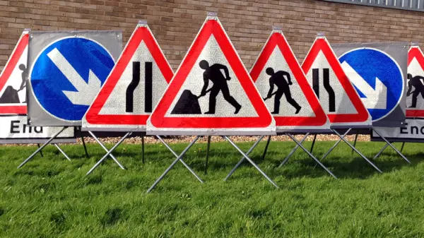Road sign kit showing various standard warnings.