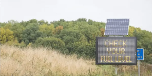 VMS-C displaying 'Check your fuel level' message.