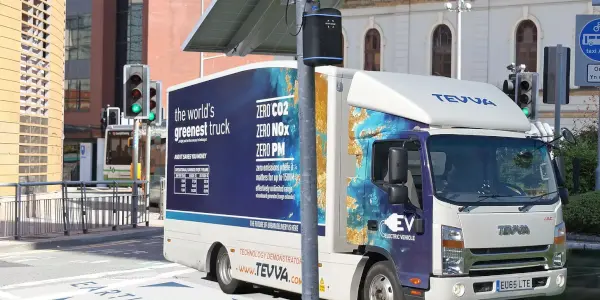 Lorry on road with zephyr air quality monitor.