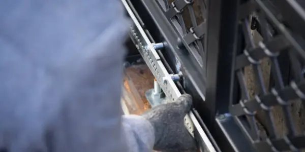 worker repairing fixed install gate mechanism