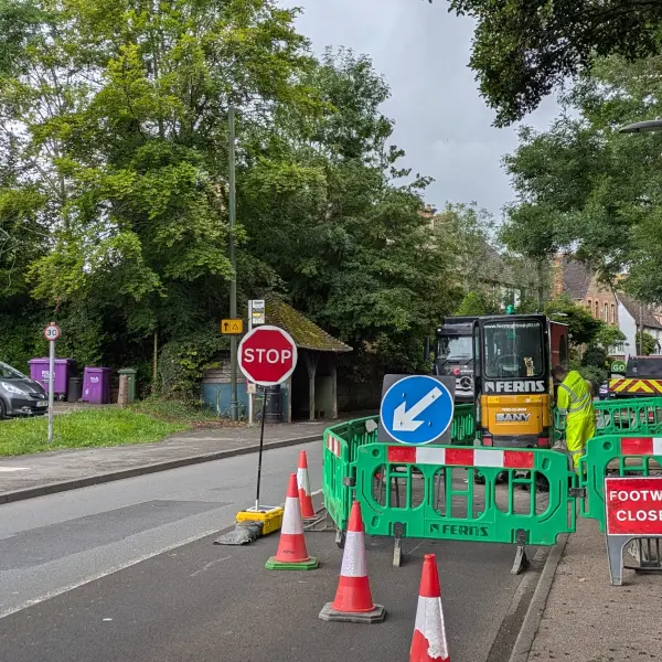 Roadworks with stop/go sign.