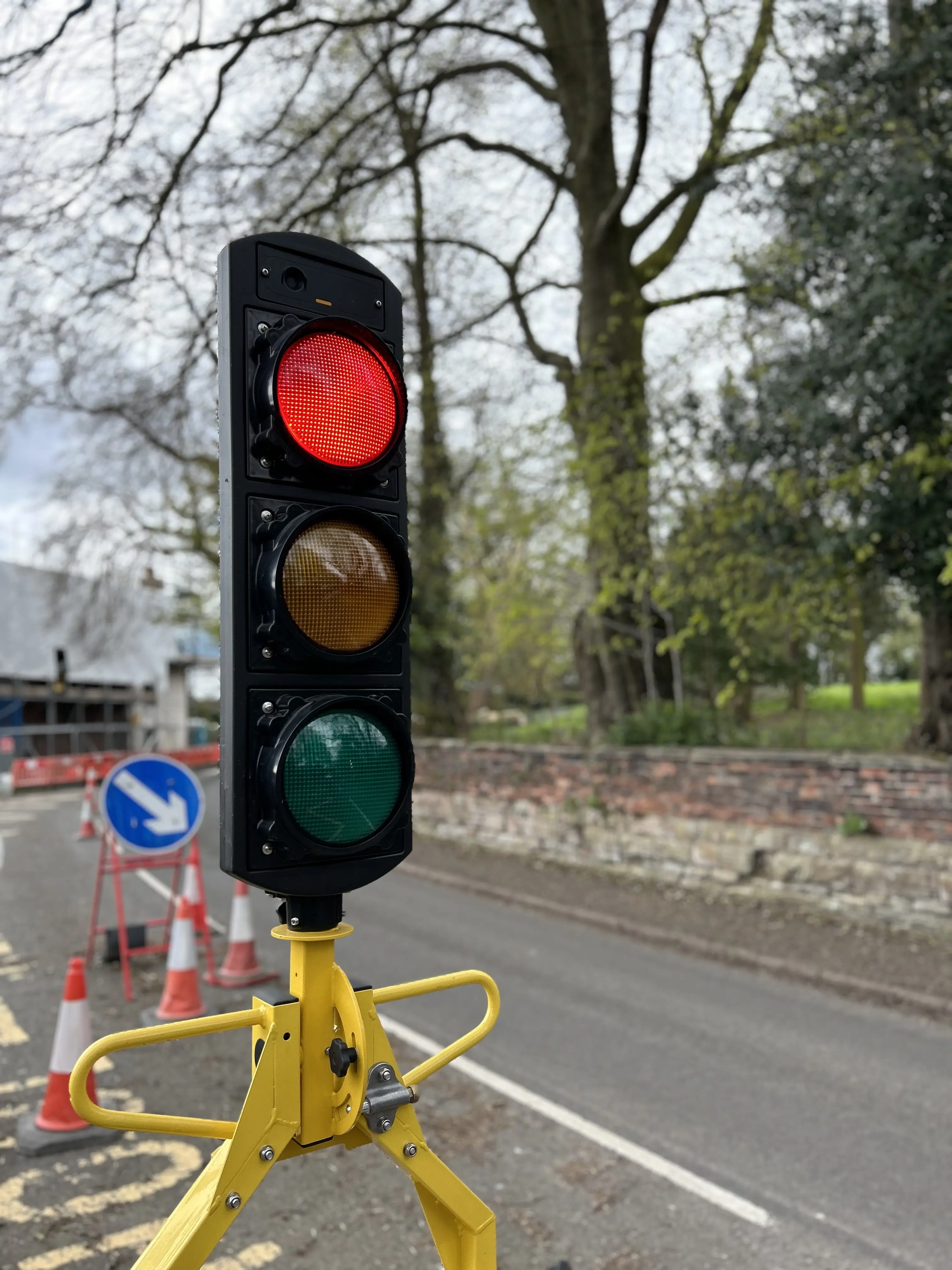 Traffic signal head showing red light.